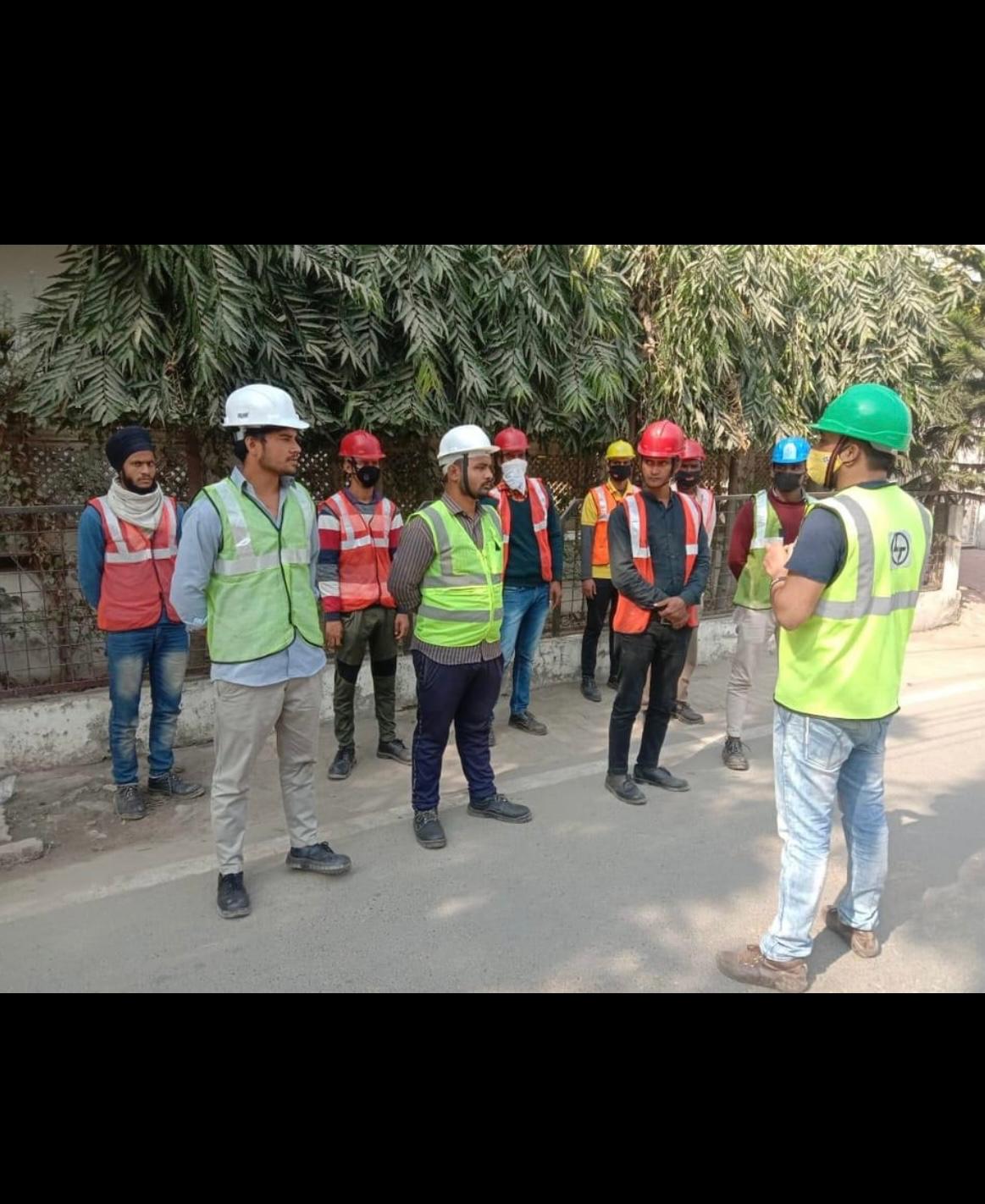 Field team gathered on site for a work briefing before installation activity